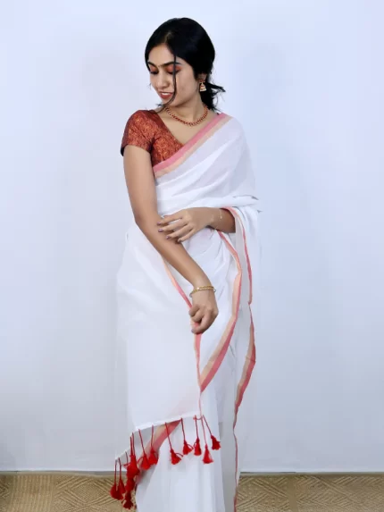 White with red and golden zari border saree
